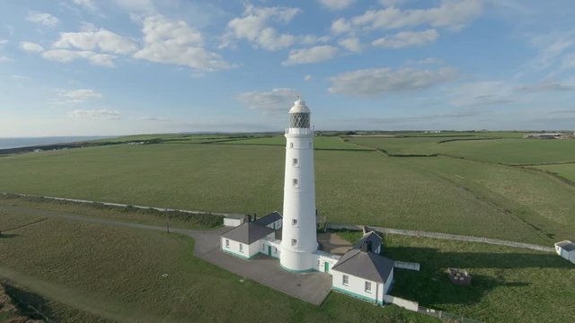 Drone footage filmed at Nash Point lighthouse during a sunset. Would make a great establishing shot