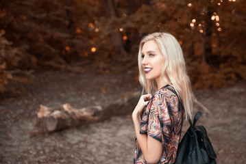 Young cheerful woman walking in nature