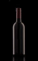 A bottle of red elite wine on a black background. Silhouette of a bottle of wine with a red stopper.