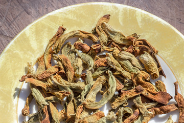 Top shoot of string beans dried under the sunlight on the plate