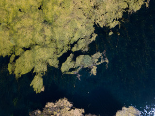 Aerial view of Blue Eye in Saranda, Albania (looks like world map)