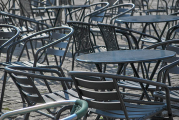 empty chairs outside a pub