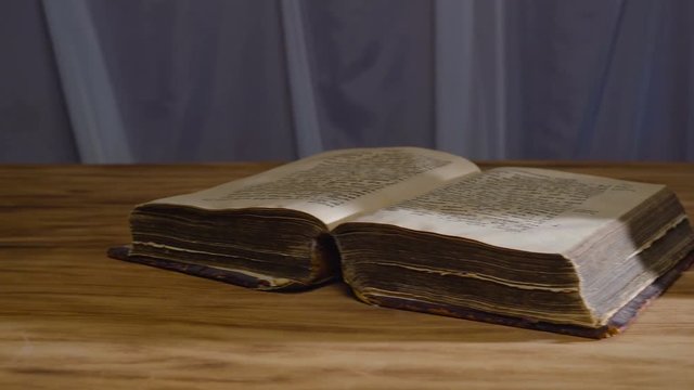 the magic rite. Ancient book and human skull. Concept for Halloween