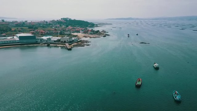 Harbor and fish farms of Boiro bay seen from above. A paradise in Galicia, Spain.