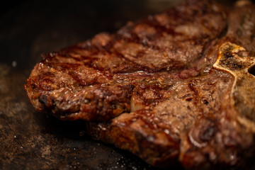 Ribeye steak on grill in meat restaurant