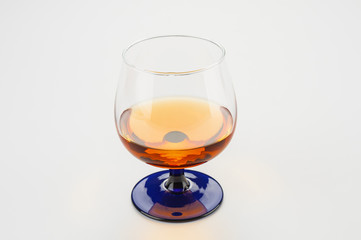 Cognac glass close up on gray background