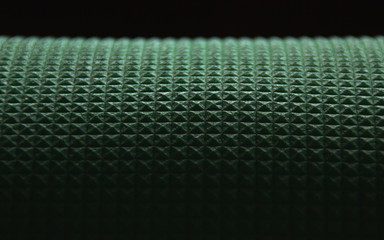 Green travel mat rolling to the dark perspective