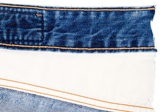 Piece of blue jeans and white fabric
