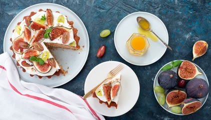 Delicious creamy tart cake with fresh figs and grape.