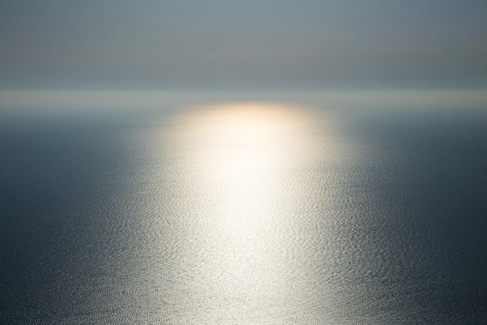 Fototapeta The magic of nature. Light on water. Gentle beautiful seascape in the Atlantic ocean with glowing solar path.