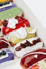 Set of delicious sweets with glaze, colorful dessert