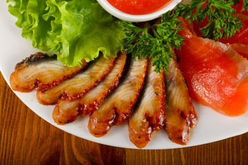 Trout fillet, red caviar and eel