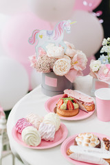 Fototapeta na wymiar Delicious cakes on festive table, desserts on pink plates