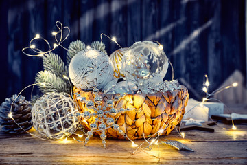 Christmas decoration in wicker basket with electric garland