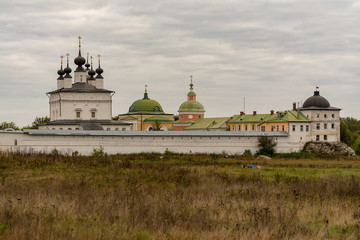 Fototapeta premium Holy Trinity Belopesotsky Convent in the cloudy autumn afternoon in a distance