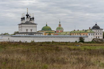 Holy Trinity Belopesotsky Convent in the cloudy autumn afternoon in a distance