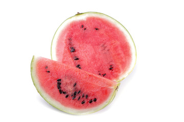 A large fresh ripe watermelon in a cut on a white isolated background