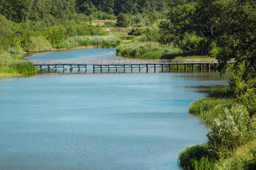Fototapeta premium Old wooden bridge over the river