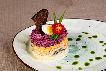 Russian traditional salad with herring