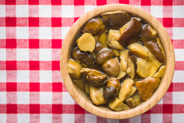 Pickled mushrooms. Marinated boletus.