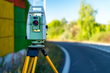 Surveyor equipment (theodolit or total positioning station) on the construction site of the...
