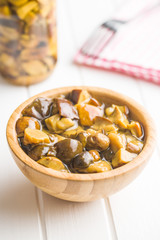 Pickled mushrooms. Marinated boletus.