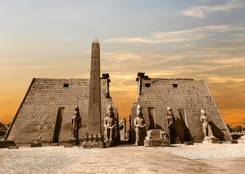 Entrance to Luxor Temple at sunset, a large Ancient Egyptian temple complex located on the east bank of the Nile River in the city today known as Luxor (Thebes). Was consecrated to the god Amon-Ra