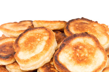 Obraz na płótnie Canvas Heap of sweet toasted pancakes isolated on white background