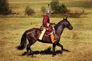 Medieval armored knight on horse from fantasy. Equestrian soldier in historical costume is in the...