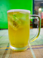glass of beer in bar background