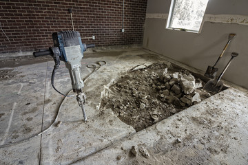 Pneumatic plugger, jackhammer, used in a reconstruction of building and broken concrete floor