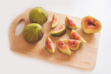 cut figs on the wooden desk