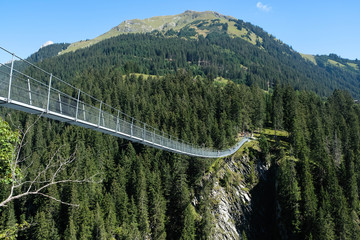 rope bridge over a deep canyon, tirol, austria