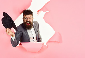 Welcome to contact us. Male fashion model with fedora hat. Bearded man inviting visit us. Fest&holiday sales. Man holds hat in hand. Beauty&fashion. Guy with cap. Seasonal sale, discount. Copy space.