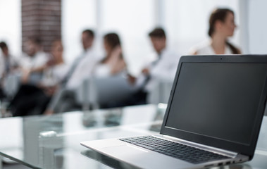 open laptop on glass office Desk