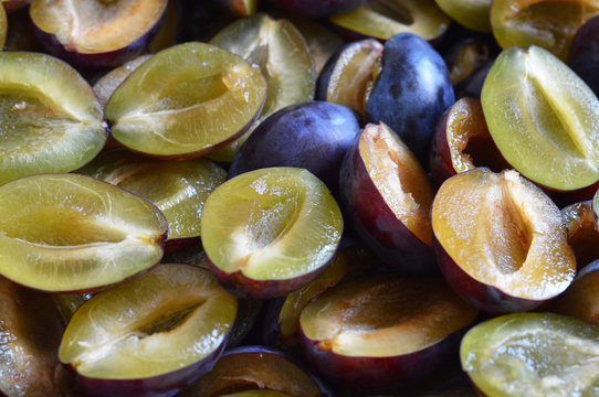 Close up of fresh plum slices. Plum slices background