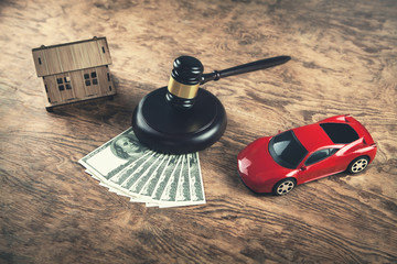 Wooden Judge Gavel, Money, House and Car. Auction and bidding concept