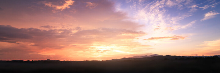 Fototapeta na wymiar Dramatic valley sky autumn sunset mountain background