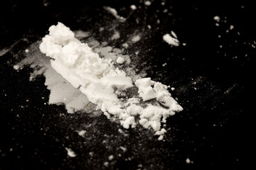 Cocaine powder on a black background
