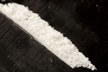 Cocaine powder on a black background