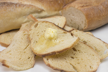 Italian bread toast with butter in white background 