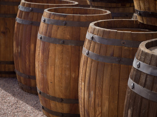Wooden barrels in a row.
