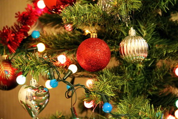 illumination garlands and Christmas Toys on the christmas tree