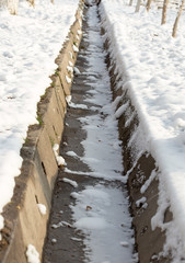 Snow cover on a concrete sewer