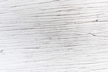 Fragment of a white concrete wall with a striped texture