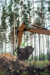 Excavator performs excavation work by digging the ground with a bucket