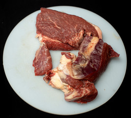 Fresh, juicy meat on a white board