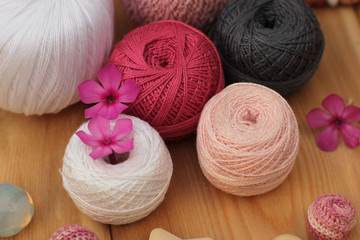 Fototapeta na wymiar pink, white, grey yarn balls