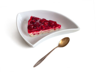 White plate with a piece of raspberry pie and a spoon