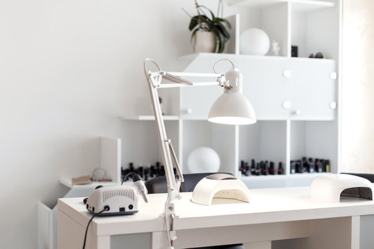 Nail care. Light studio for manicure with a tool